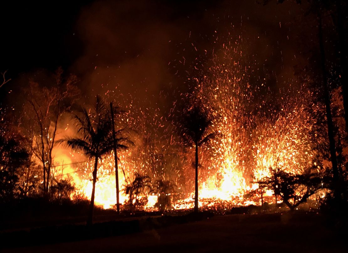 Lava errupts from a fissure on a street in Leilani Estates after Kilauea's eruption last week.