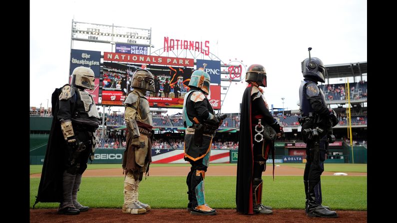 Costumed characters line up for the National Anthem before a Major League Baseball game in Washington on Saturday, May 5. Many sports teams held "Star Wars" promotions this weekend. <a href="index.php?page=&url=https%3A%2F%2Fwww.cnn.com%2F2018%2F05%2F04%2Fentertainment%2Fwhat-is-star-wars-day-feat%2Findex.html" target="_blank">Related story: What is Star Wars Day?</a>