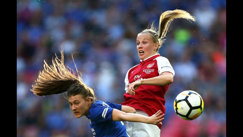 Chelsea's Hannah Blundell, left, and Arsenal's Beth Mead compete for a header during the FA Cup final in London on Saturday, May 5. Chelsea won the match 3-1.