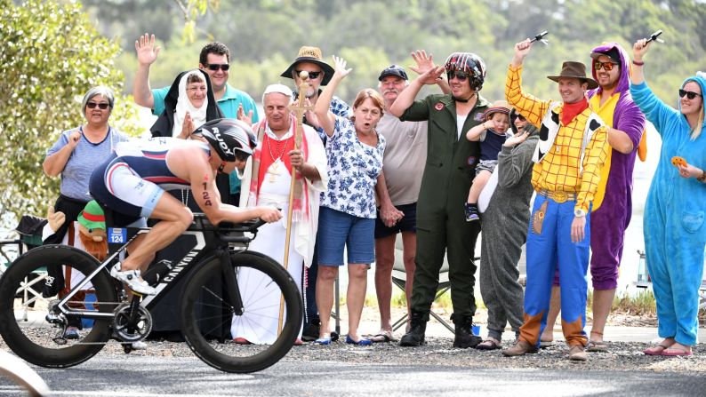 Spectators wear costumes as they cheer on Ironman competitors in Port Macquarie, Australia, on Sunday, May 6.