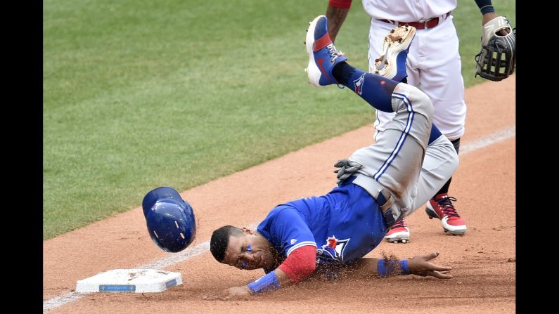 Toronto second baseman Yangervis Solarte slides into third base during a Major League Baseball game in Cleveland on Thursday, May 3.