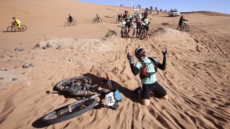 A competitor reacts after crossing a sand dune during the Titan Desert bike race in Morocco on Wednesday, May 2. The race takes place over six days and is nearly 400 miles long.