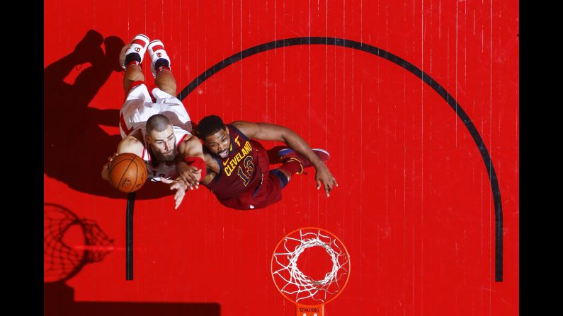 Toronto's Jonas Valanciunas, left, is defended by Cleveland's Tristan Thompson during Game 1 of their NBA playoff series on Tuesday, May 1.