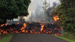 A lava flow moves down Makamae Street in Leilani Estates Sunday.