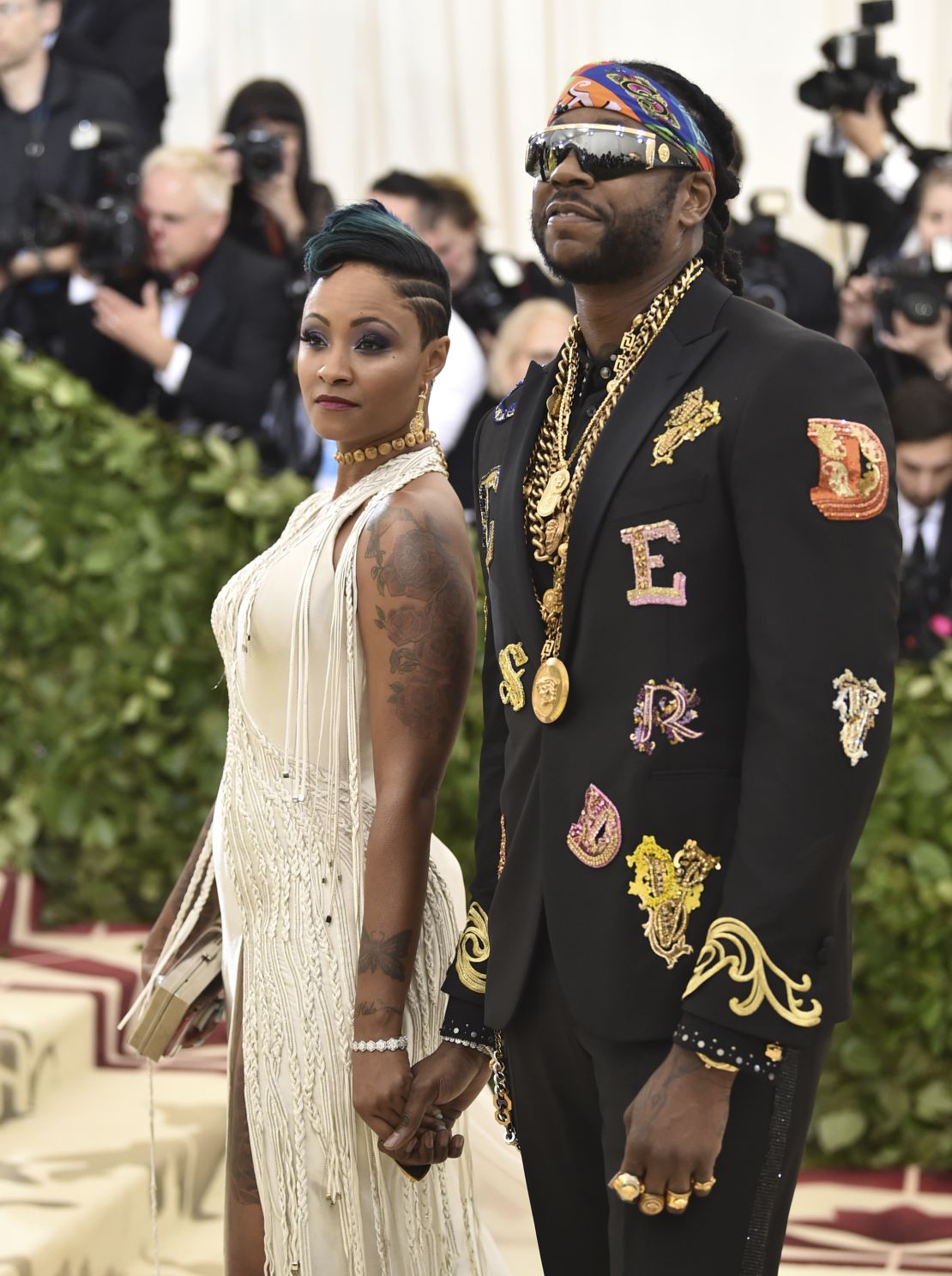 2 Chainz (right) and Kesha Ward walk the red carpet at the 2018 Met Gala in New York.