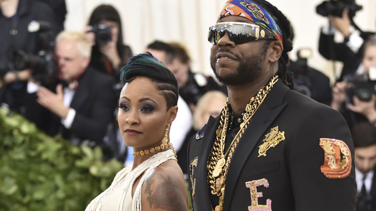 2 Chainz (right) and Kesha Ward walk the red carpet at the 2018 Met Gala in New York.