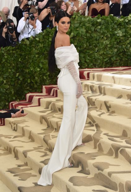 Kendall Jenner wears a white jumpsuit to the event.