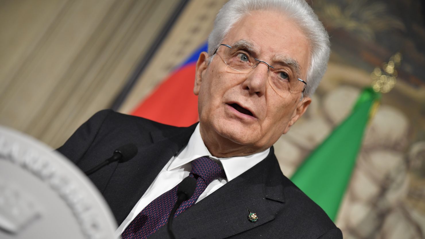 Italian President Sergio Mattarella addresses journalists after consultations with political parties.