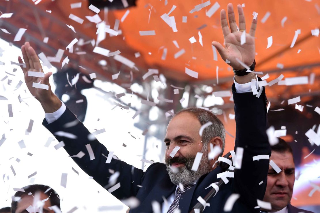Pashinyan greets supporters in Republic Square, Yerevan, after his victory.
 