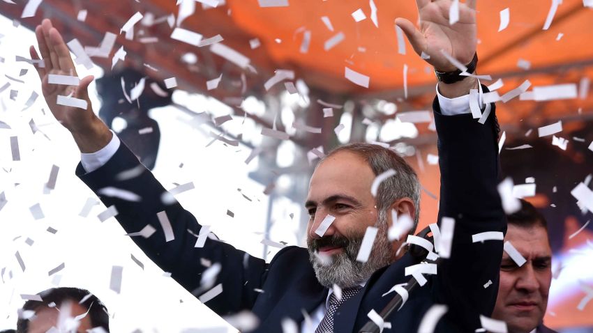 Armenian opposition leader Nikol Pashinyan gestures to supporters after being elected as prime minister in Yerevan's Republic Square on May 8, 2018. (Photo by Sergei GAPON / AFP)        (Photo credit should read SERGEI GAPON/AFP/Getty Images)