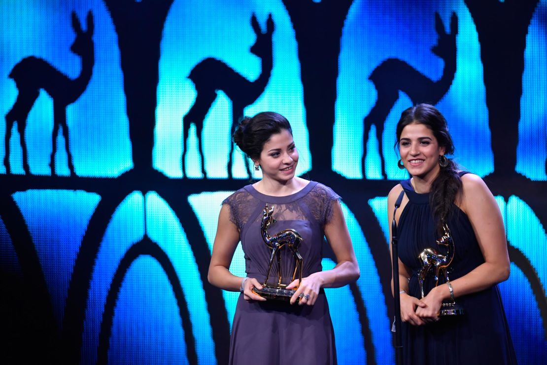 Yusra and Sara Mardini are seen on stage at the 2016 Bambi Awards. Sara has gone back to the the scene of their plight in Lesbos, in order to help others making similar journeys.