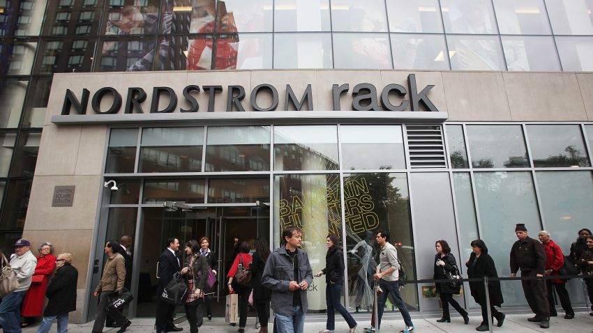 NEW YORK - MAY 11:  Shoppers wait in line to enter on opening day of the new Nordstrom Rack store May 11, 2010 in New York City. The 32,000-square-foot basement discount store in Manhattan's Union Square is Nordstrom's first store in New York City.  (Photo by Mario Tama/Getty Images)