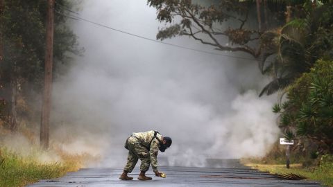 Army National Guard First Lt. Aaron Hew Len measures sulfur dioxide gas Tuesday in Leilani Estates.