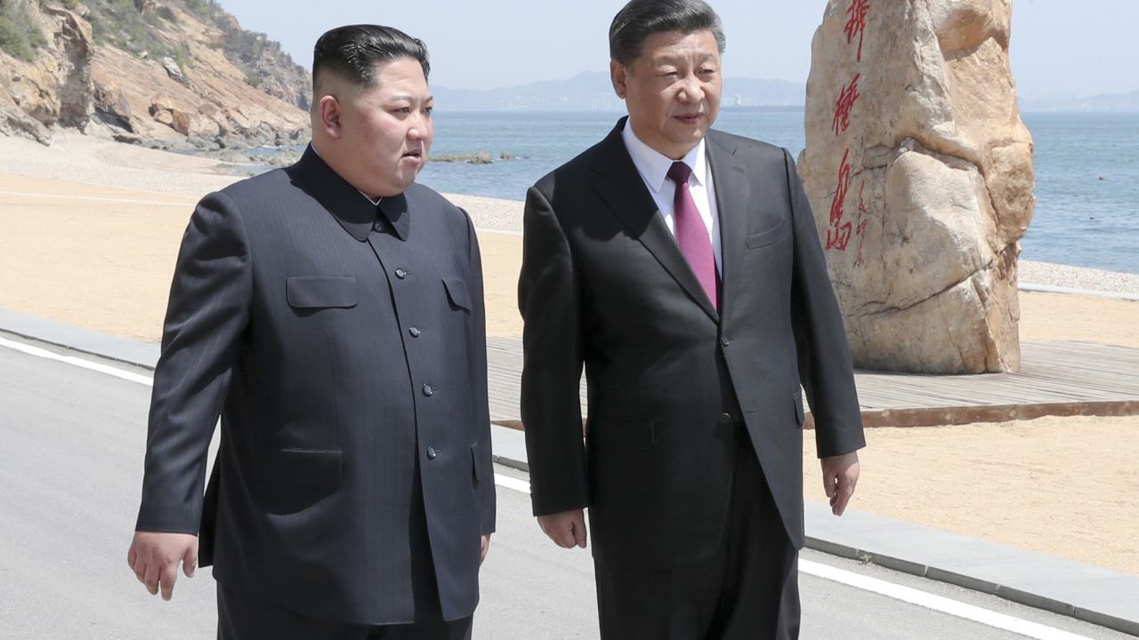 In this photo taken between May 7 and 8, 2018 released by Xinhua News Agency, Chinese President Xi Jinping, right, walks with North Korean leader Kim Jong Un during a meeting in Dalian in northeastern China's Liaoning Province. (Ju Peng/Xinhua via AP)