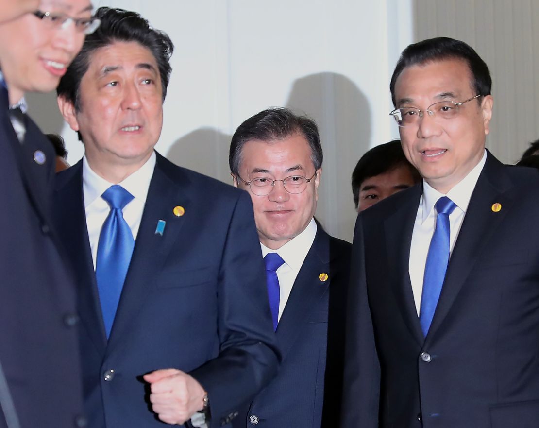 Japan's Shinzo Abe, from left, South Korea's Moon Jae-in and China's Li Keqiang meet in Tokyo.