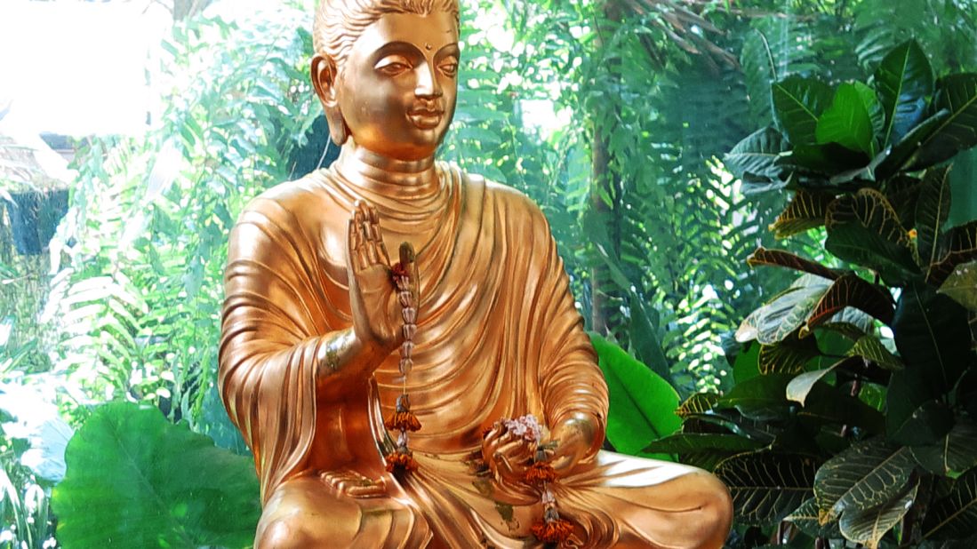 <strong>Modern and causal: </strong>This informal, shaded outdoor courtyard cafe also includes a small fish pond, a Buddha statue and modern, mostly black, decor. 