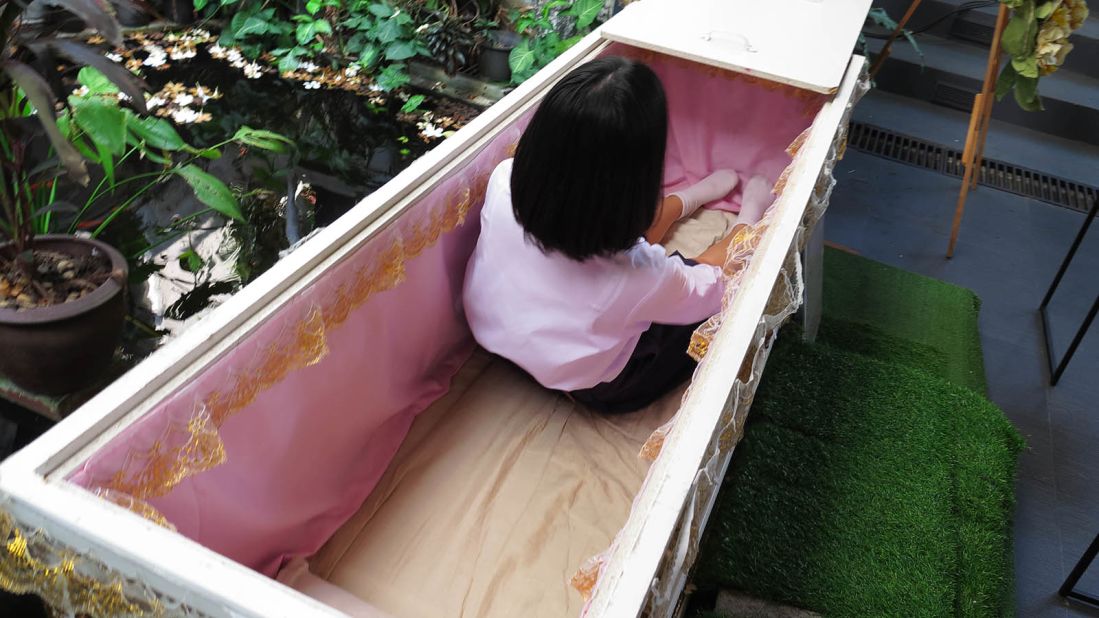 <strong>The coffin test: </strong>Take off your shoes, climb into the Buddhist coffin and relax on your back on soft padding as a wooden lid slides over you.