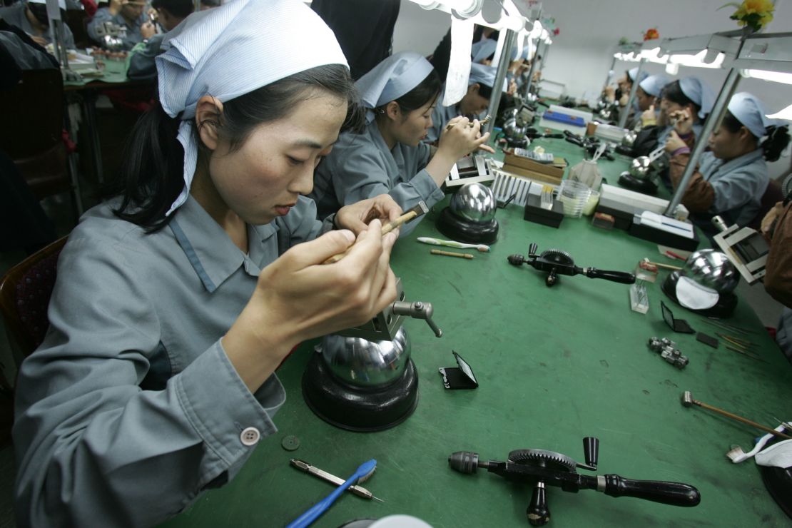 North Korean women work at the assembly line of the factory of South Korean watch company Romanson at the Kaesong industrial complex on May 22, 2007.