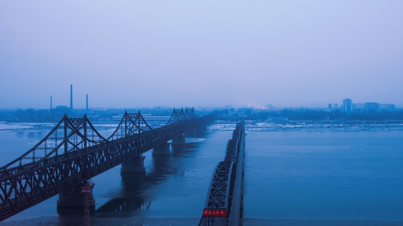 Fog is seen on the banks of the Yalu River in the Chinese border town of Dandong, opposite to the North Korean town of Sinuiju, on February 8, 2016. 