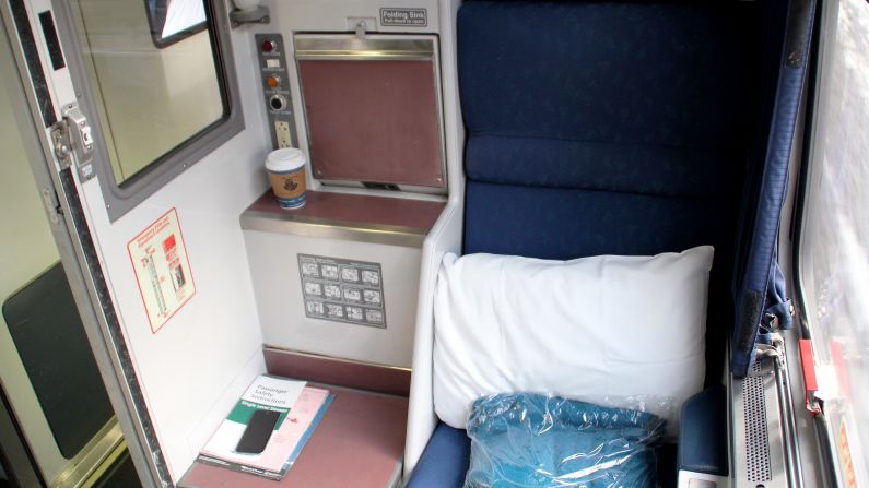 The toilet cover doubles as a table and a stepladder to the bunk above.