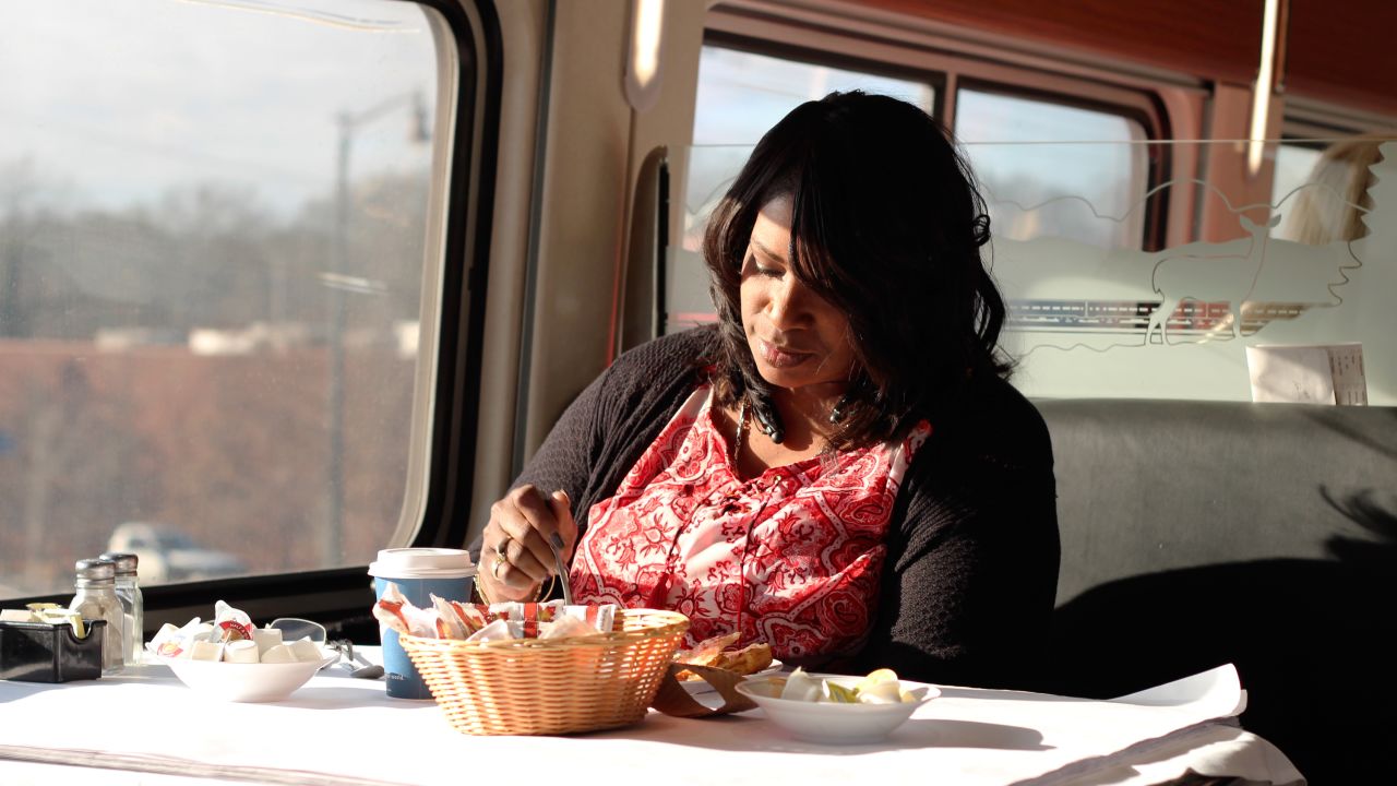 Passenger Lorraine Carr eats breakfast in the dining car. Carr was riding the train from Atlanta to Birmingham, Alabama, where she planned to have lunch before riding back.