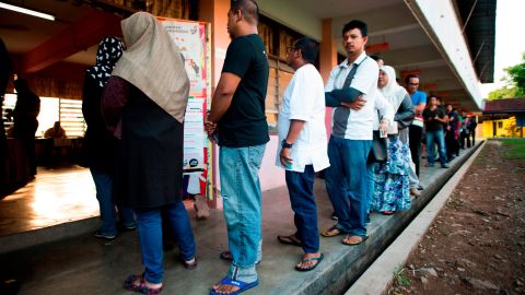 Voters cast their ballots at a polling station during Malaysia's 14th general election on Wednesday. The country's Prime Minister Najib Razak suffered a stunning defeat at the polls.