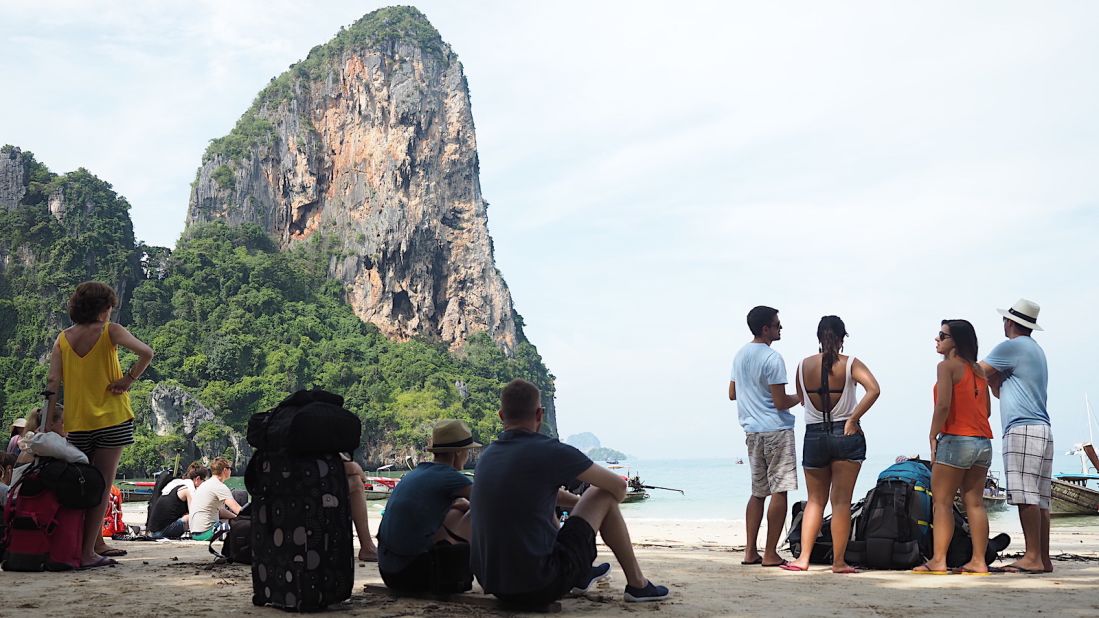 <strong>World's most beautiful pickup point?: </strong>Travelers wait in the shade on Railay West for the ferry that will shuttle them to Phi Phi Islands.  