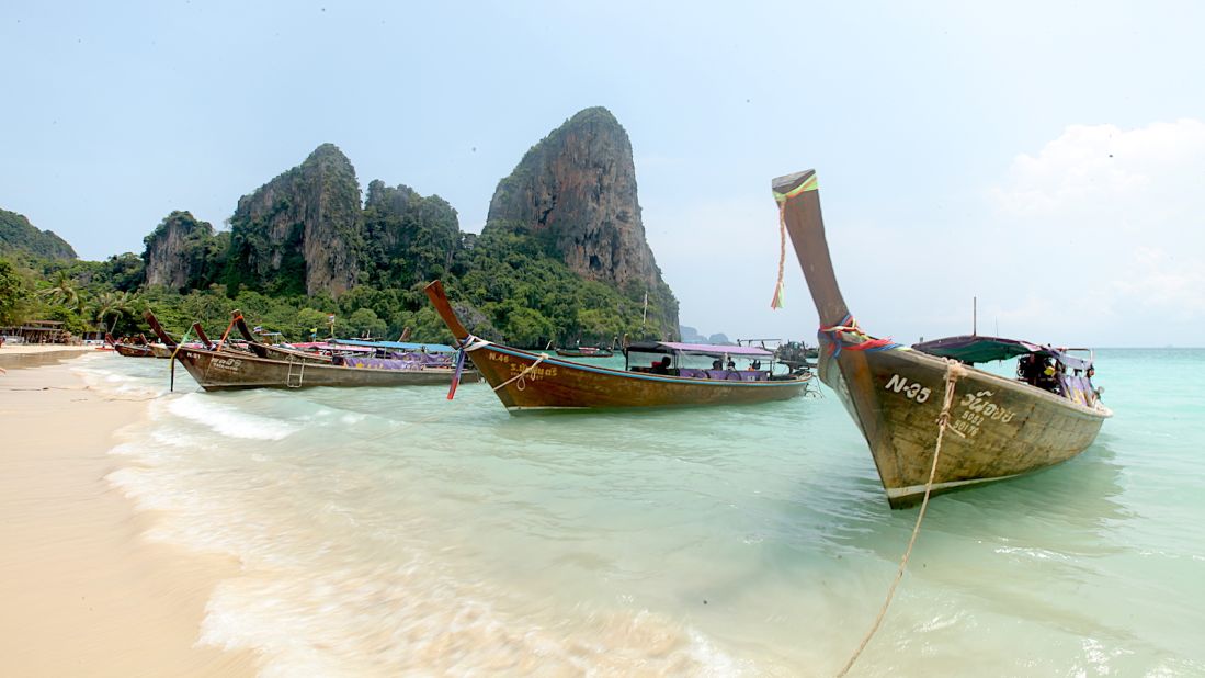 <strong>Railay West: </strong>A row of long-tail boats on Railay West, one of four stretches of sand that make up Railay Beach.