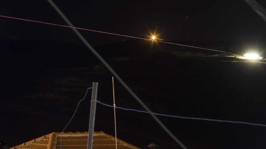 epa06724102 A long exposure picture shows Israeli artillery deployed missiles toward Syrian military targets, on the Golan Heights,  next to the Israeli-Syrian border 10 May 2018.  Israeli spokesperson said that the defense systems identified approximately 20 rockets launched by the Iranian Quds forces at Israeli army forward posts on the Golan Heights.  A number of rockets were intercepted by the  Iron Dome aerial defense system. No injuries were reported.  EPA/ATEF SAFADI