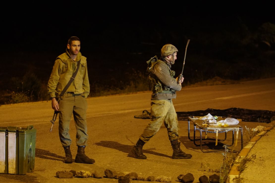 An Israeli soldiers stands on a closed road in the Golan Heights early Thursday. 