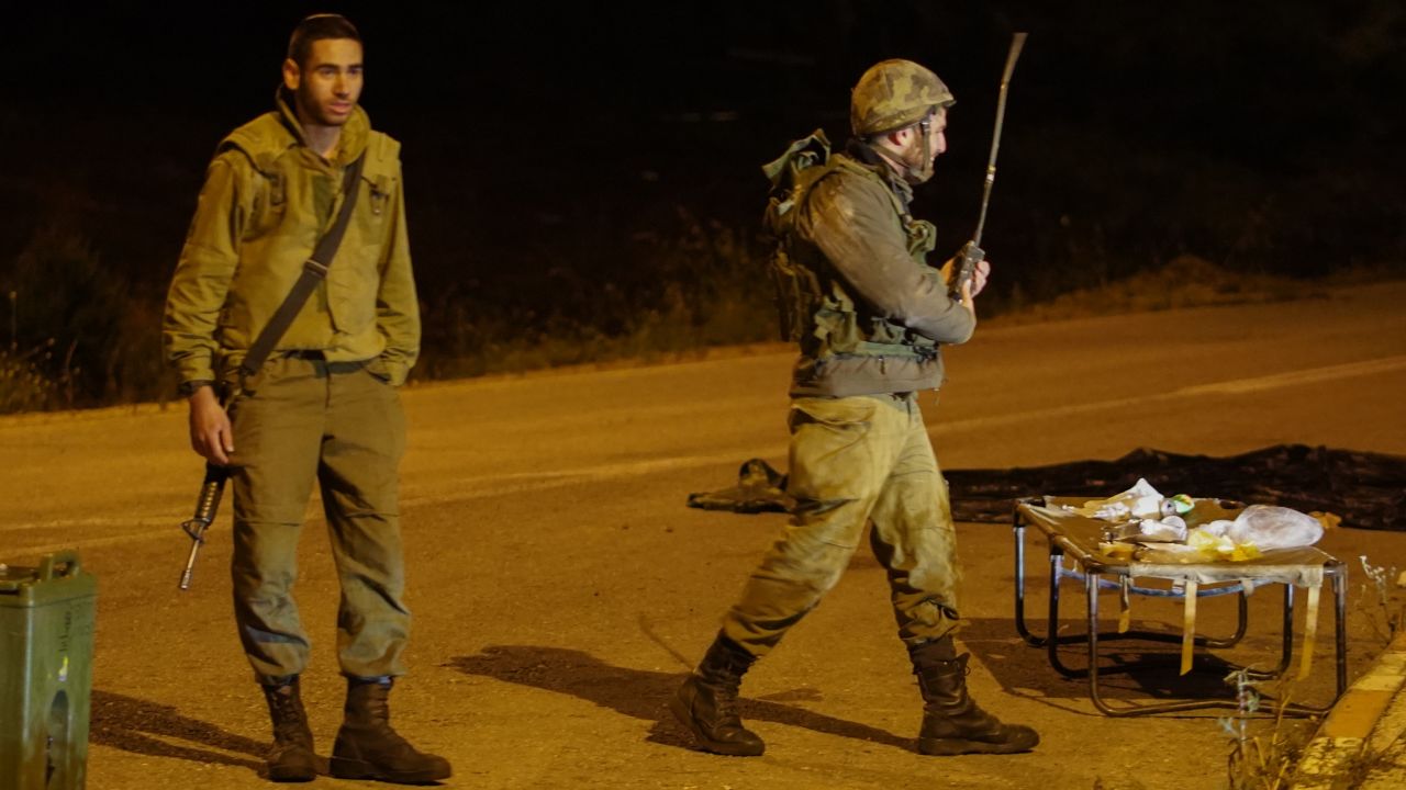 An Israeli soldiers stands on a closed road in the Golan Heights early Thursday.