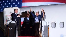 US President Donald Trump (L) applauds as US detainee Kim Dong-chul (2nd R) gestures upon his return with Kim Hak-song (C) and Tony Kim (behind) after they were freed by North Korea, at Joint Base Andrews in Maryland on May 10, 2018. - Trump was to greet the three US citizens released by North Korea at the air base near Washington early on May 10, underscoring a much needed diplomatic win and a stepping stone to a historic summit with Kim Jong Un. (Photo by SAUL LOEB / AFP)        (Photo credit should read SAUL LOEB/AFP/Getty Images)