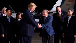 US President Donald Trump (centre L) shakes hands with US detainee Kim Dong-chul (3rd R) upon his return with fellow detainees Kim Hak-song (R) and Tony Kim (front L) after they were freed by North Korea, at Joint Base Andrews in Maryland on May 10, 2018. - US President Donald Trump greeted the three US citizens released by North Korea at the air base near Washington early on May 10, underscoring a much needed diplomatic win and a stepping stone to a historic summit with Kim Jong Un. (Photo by SAUL LOEB / AFP)        (Photo credit should read SAUL LOEB/AFP/Getty Images)