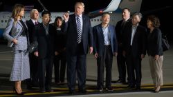 US President Donald Trump (C) speaks upon the arrival of US detainees Kim Dong-chul (4th R), Kim Hak-song (2nd R) and Tony Kim (3rd L) after they were freed by North Korea, at Joint Base Andrews in Maryland on May 10, 2018. - US President Donald Trump greeted the three US citizens released by North Korea at the air base near Washington early on May 10, underscoring a much needed diplomatic win and a stepping stone to a historic summit with Kim Jong Un. (Photo by SAUL LOEB / AFP)        (Photo credit should read SAUL LOEB/AFP/Getty Images)
