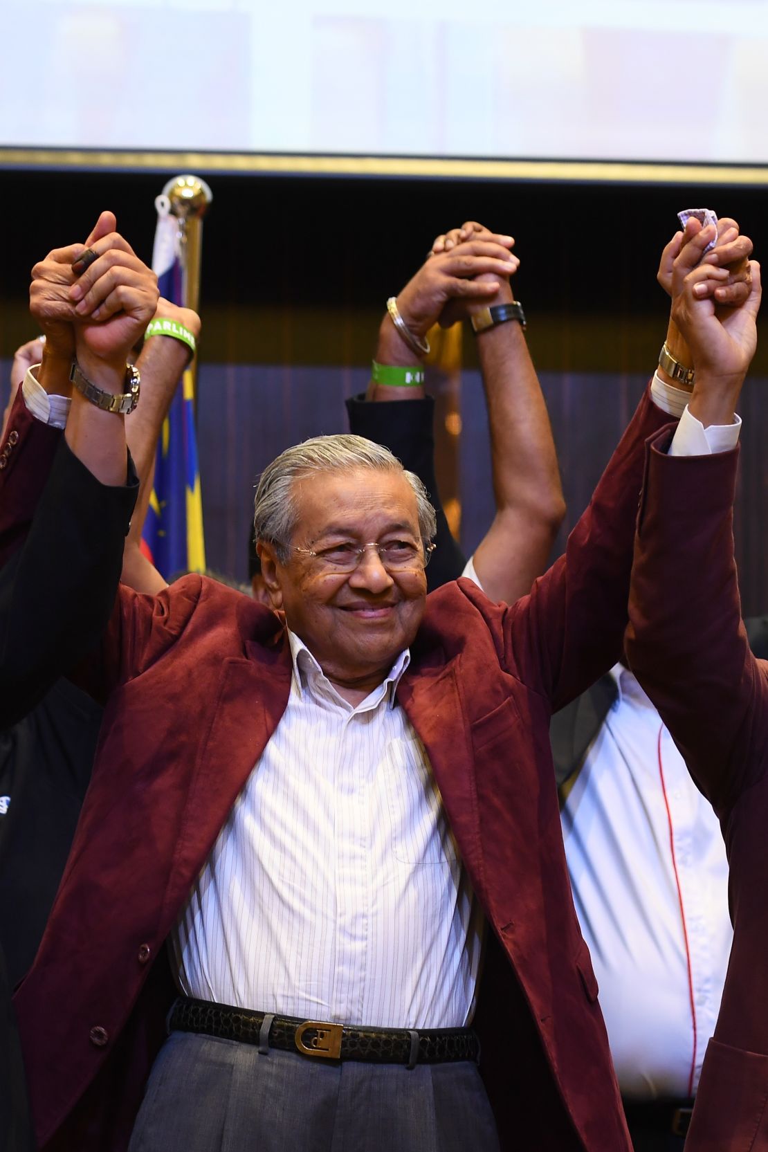 Mahathir Mohamad celebrates with his coalition leaders during a press conference in Kuala Lumpur on May 10.