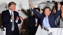 US President Donald Trump (L) applauds as US detainee Kim Dong-chul (2nd R) gestures upon his return with fellow detainees Kim Hak-song and Tony Kim (behind) after they were freed by North Korea, at Joint Base Andrews in Maryland on May 10, 2018. - US President Donald Trump greeted the three US citizens released by North Korea at the air base near Washington early on May 10, underscoring a much needed diplomatic win and a stepping stone to a historic summit with Kim Jong Un. (Photo by Nicholas Kamm / AFP) (Photo credit should read NICHOLAS KAMM/AFP/Getty Images)