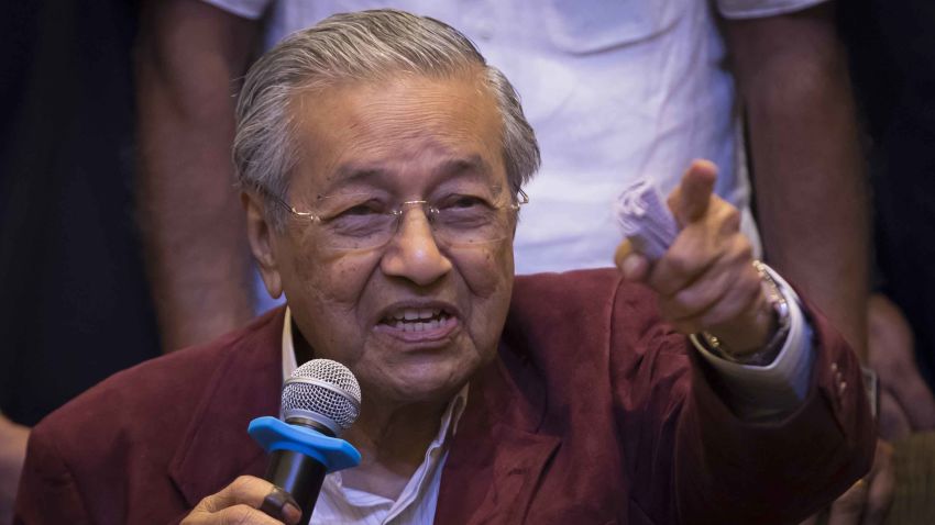 Mahathir Mohamad, center, speaks to the media at a hotel in Kuala Lumpur, Malaysia, Wednesday, May 9, 2018. Official results from Malaysia's national election show the opposition alliance led by the country's former authoritarian ruler Mahathir Mohamad has won a majority in parliament, ending the 60-year rule of the National Front. (AP Photo/Vincent Thian)