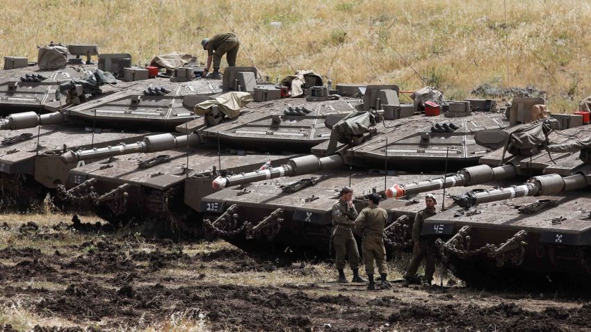 Israeli Merkava tanks are seen in a deployment area near the Syrian border in the Golan Heights on May 10, 2018.  (Photo credit should read MENAHEM KAHANA/AFP/Getty Images)