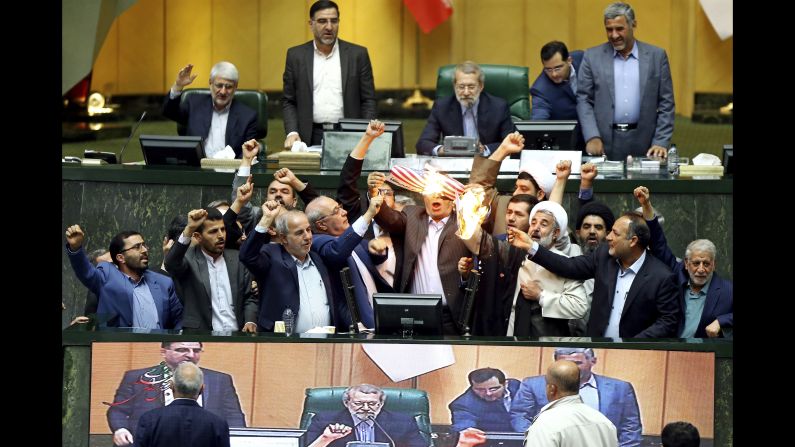 Hardline Iranian lawmakers <a href="https://www.cnn.com/2018/05/09/middleeast/iran-reacts-nuclear-deal-intl/index.html" target="_blank">burn two pieces of papers in parliament</a> on Wednesday, May 9, after US President Donald Trump <a href="https://www.cnn.com/2018/05/08/politics/donald-trump-iran-deal-announcement-decision/index.html" target="_blank">withdrew from a nuclear deal</a> and restored sanctions against Iran. The two papers represented the US flag and the nuclear deal, and the lawmakers chanted "death to America."
