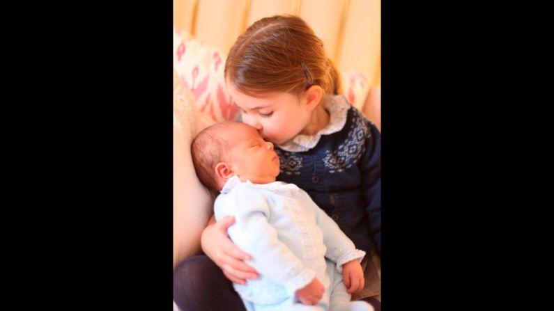 Britain's Princess Charlotte, the 2-year-old daughter of Prince William and Duchess Catherine, kisses her new baby brother, Prince Louis, in this photo <a href="https://www.cnn.com/2018/05/05/europe/prince-louis-princess-charlotte-photos-intl/index.html" target="_blank">released by Kensington Palace</a> on Sunday, May 6.