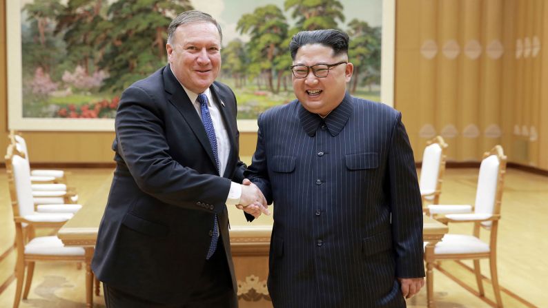 US Secretary of State Mike Pompeo, left, shakes hands with North Korean Kim Jong Un in this photo taken Wednesday, May 9, and provided by the North Korean government. <a href="https://www.cnn.com/2018/05/09/politics/mike-pompeo-north-korea-prisoners-tick-tock/index.html" target="_blank">Pompeo was in the North Korean capital of Pyongyang</a> to discuss Kim's upcoming summit with US President Donald Trump.
