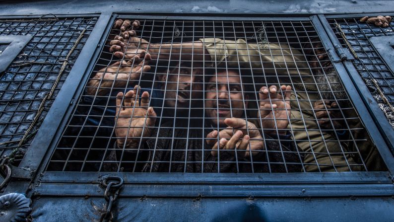 Detained protesters shout slogans from a police vehicle in Srinagar, India, on Monday, May 7. They were protesting against Indian government forces, who <a href="https://www.cnn.com/2018/04/03/asia/violence-kashmir-isis-intl/index.html" target="_blank">have been clashing with militant groups</a> in Indian-administered Kashmir.