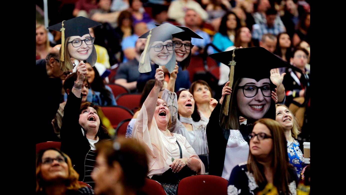 People show their support for a graduate of Ramapo College during a commencement ceremony in Newark, New Jersey, on Thursday, May 10.