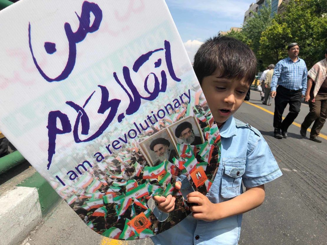 A young boy takes part in an demonstration in Tehran.