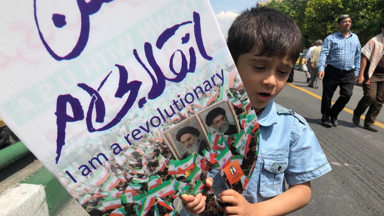 A young boy takes part in an demonstration in Tehran.