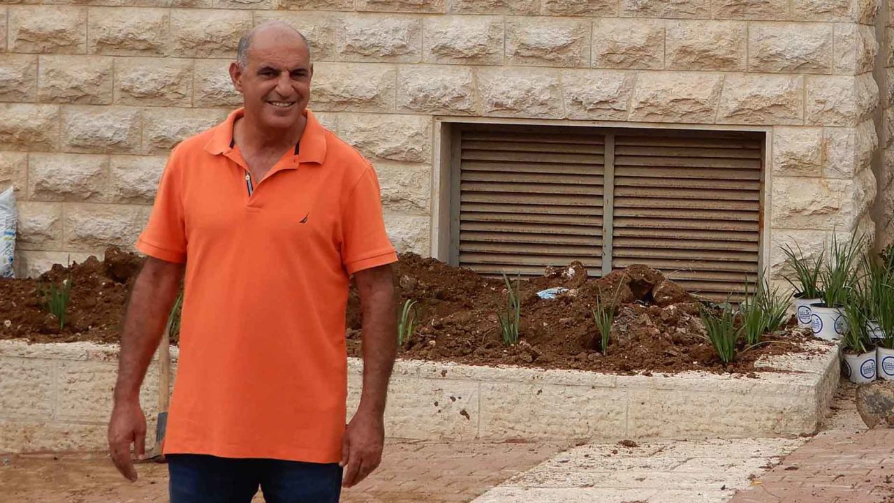 Shimon Aviv, a 45-year-old gardener planting new flowers for the ceremony on Monday.
