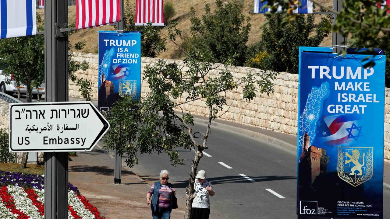 People walk near the compound of the US consulate in Jerusalem, which will host the new US embassy.