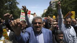 Iranian protestors chant slogans during a gathering after their Friday prayer in Tehran, Iran, Friday, May 11, 2018. Thousands of Iranians took to the streets in cities across the country to protest U.S. President Donald Trump's decision to pull out of the nuclear deal with world powers. (AP Photo/Vahid Salemi)