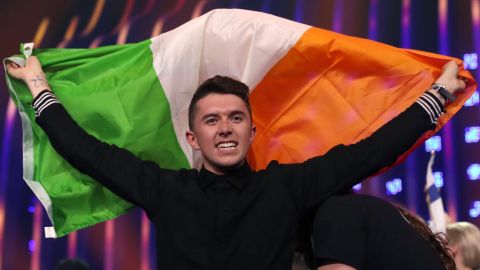 Singer Ryan O'Shaughnessy holds up an Irish national flag in the first semifinal of the 63rd edition of the 2018 Eurovision Song Contest at Lisbon Arena.