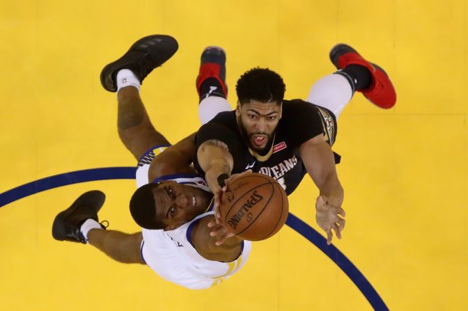 Golden State's Kevon Looney, left, and New Orleans' Anthony Davis compete for a rebound during an NBA playoff game on Tuesday, May 8. Golden State <a target="_blank" target="_blank">won the series in five games</a> to advance to the Western Conference Finals.
